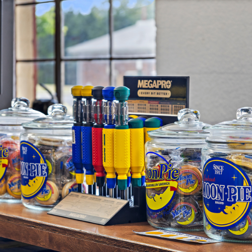 Four glass jars with Moon Pies in them and MegaPro bits display in the center of the four jars.