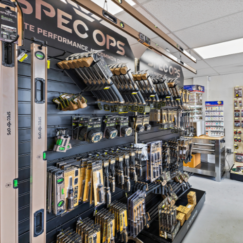 Our Spec Ops tool wall filled with hammers, screwdrivers, tape measures, levels, clamps, and more.