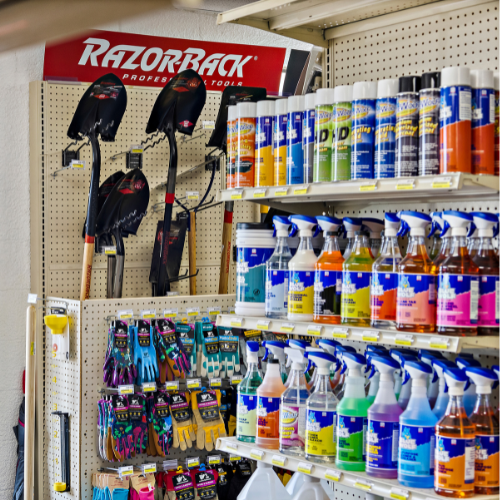 Our selection of Blue Wolf cleaning supplies in the forefront with Razor-Back shovels in the background.