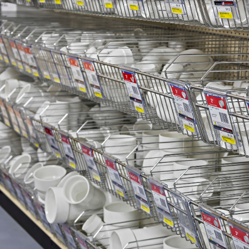 Our selection of pipe fittings neatly sorted on a shelf.