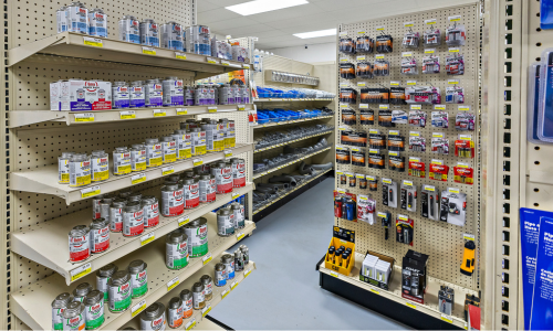 Two end caps in our store filled with Oatey cleaners, batteries from brands like Duracell and Energizer, and flashlights from Eveready and Coast.