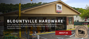 Storefront of BLOUNTVILLE HARDWARE. Beige building with an orange University of Tennessee flag. Lawn and garden supplies on the left, wheelbarrows by the door, and tools like rakes and pickaxes on the right. > Your locally owned and operated neighborhood hardware store proud to help the Blountville, TN community with all of it's hardware needed.